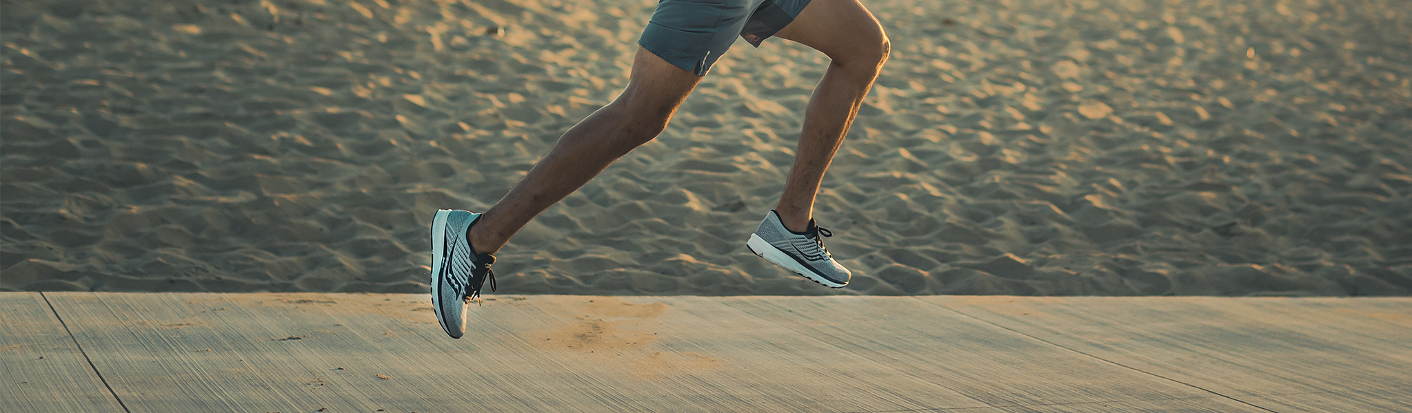 A man running in Saucony shoes 