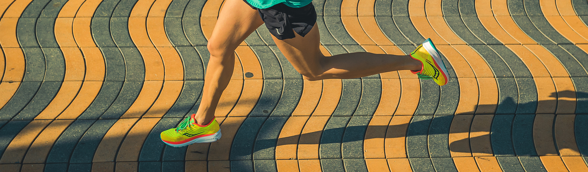 A woman running in Saucony shoes 