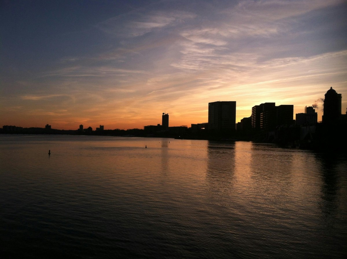 An image of the sun setting over Boston 