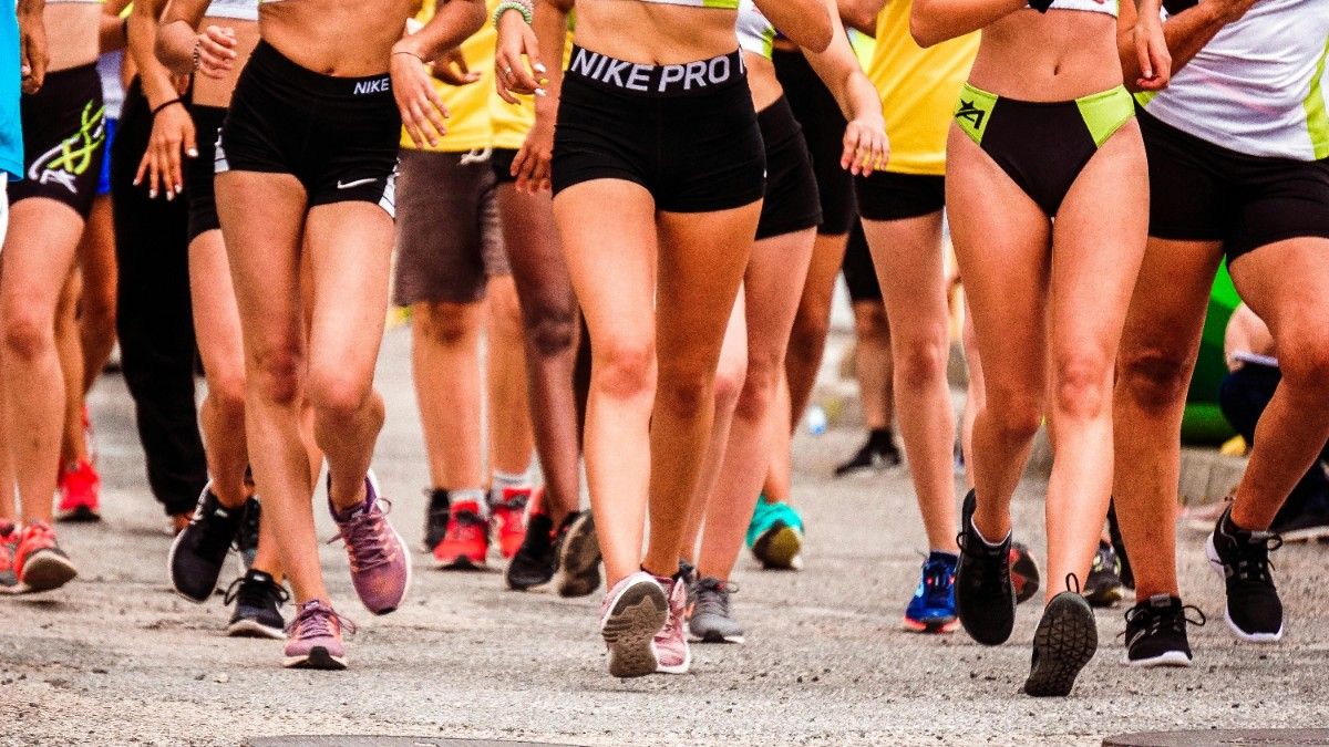 A photo of a group of people running 