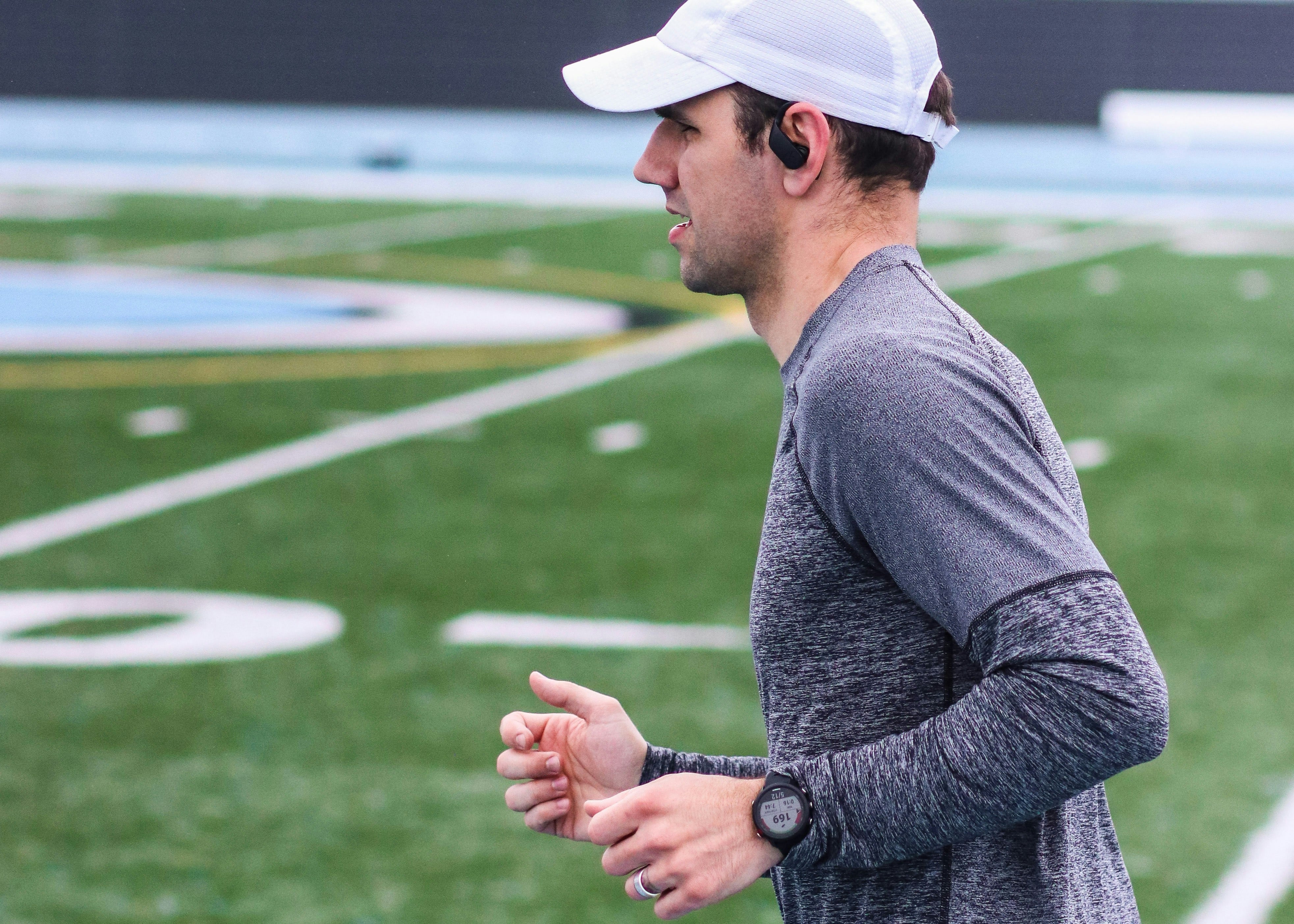 An image of a person running wearing their Garmin watch 