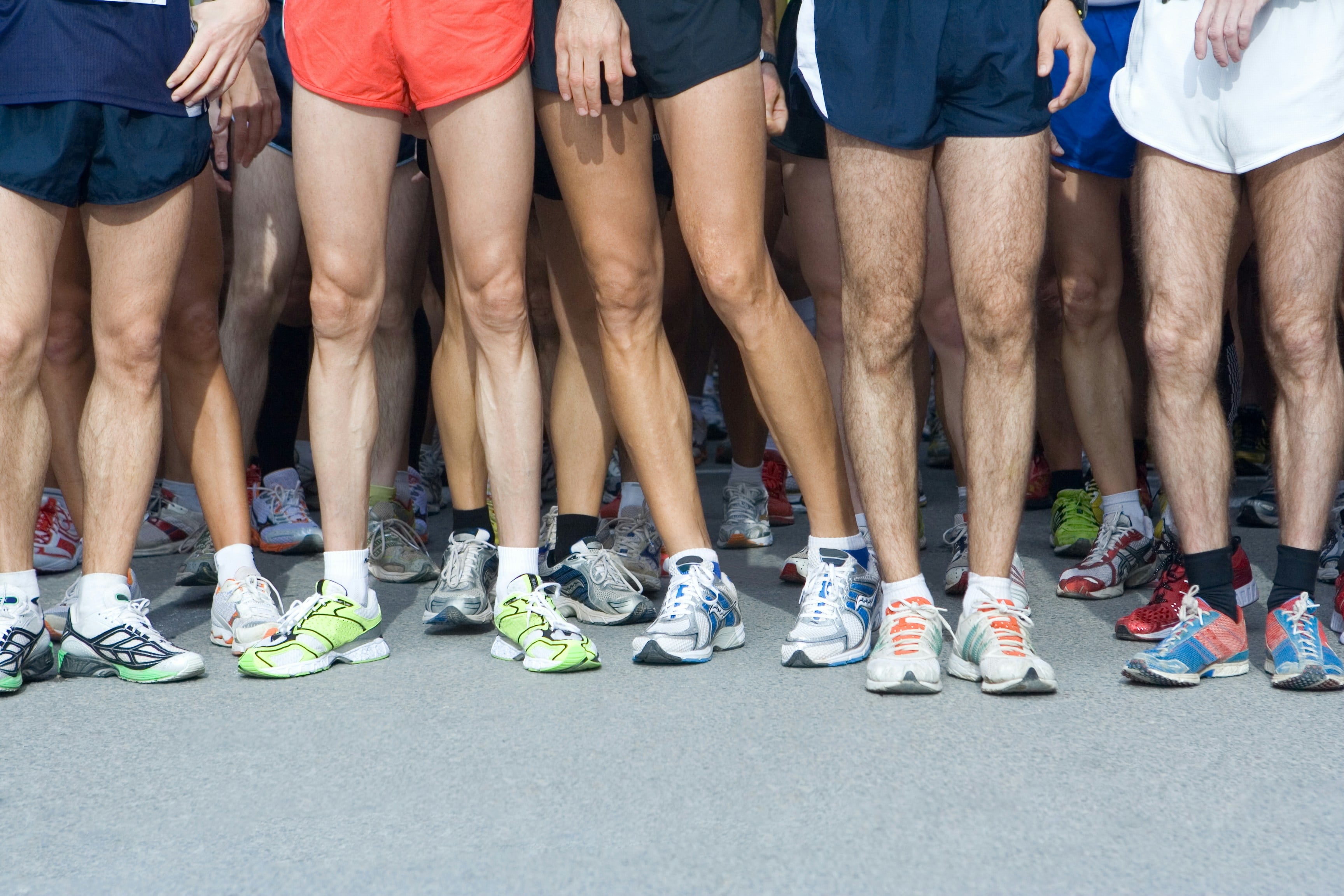 Royal Parks Half Marathon. An image people stood in a group with their running shoes and shorts