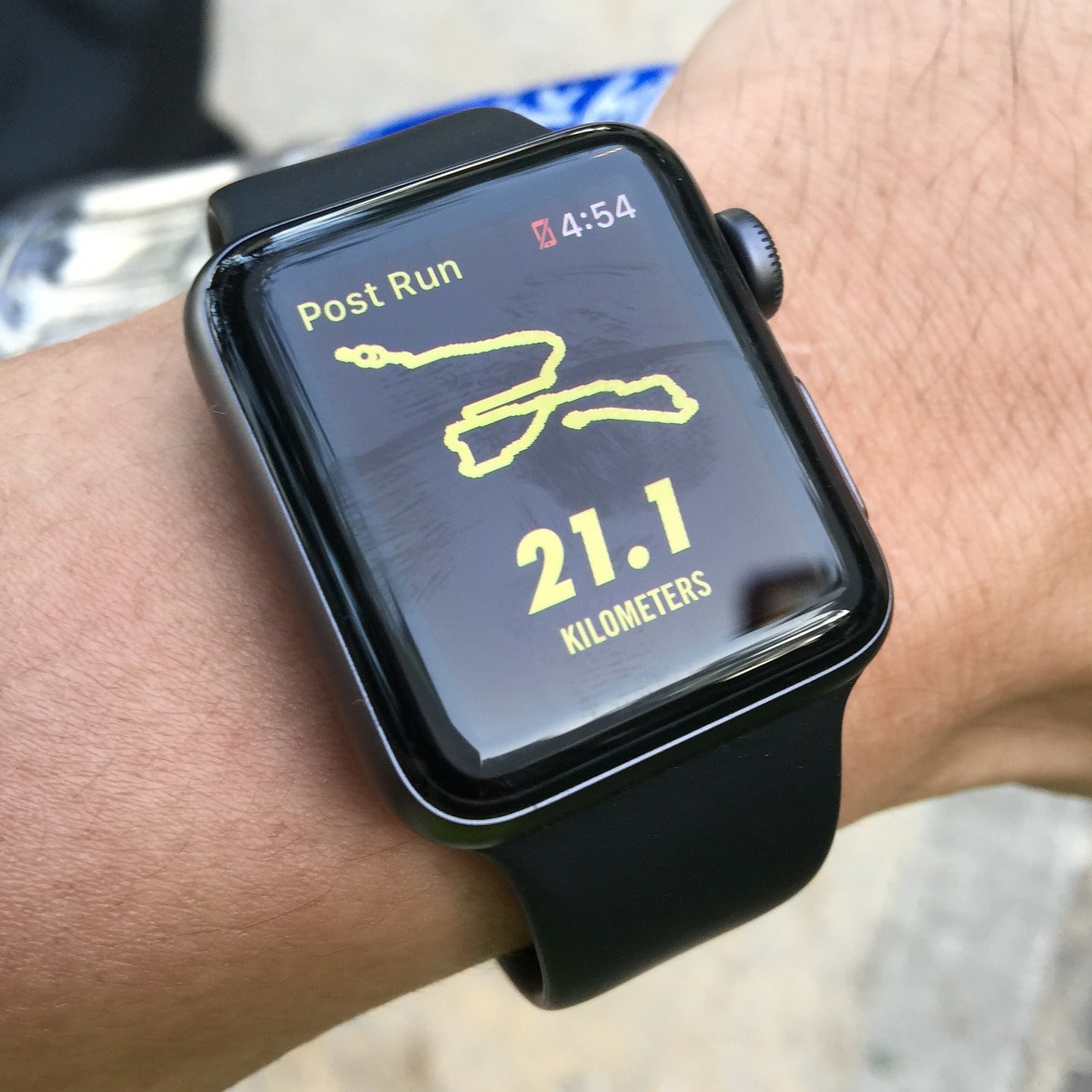 An image of a person's fitness watch showing the completion of a half marathon