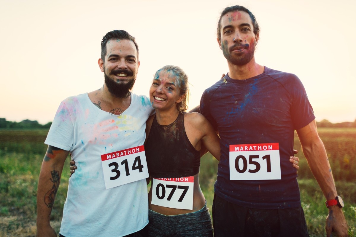 Three people are a colour run 