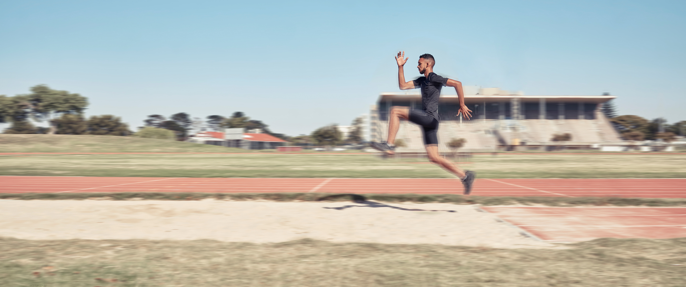 A man doing the long jump 