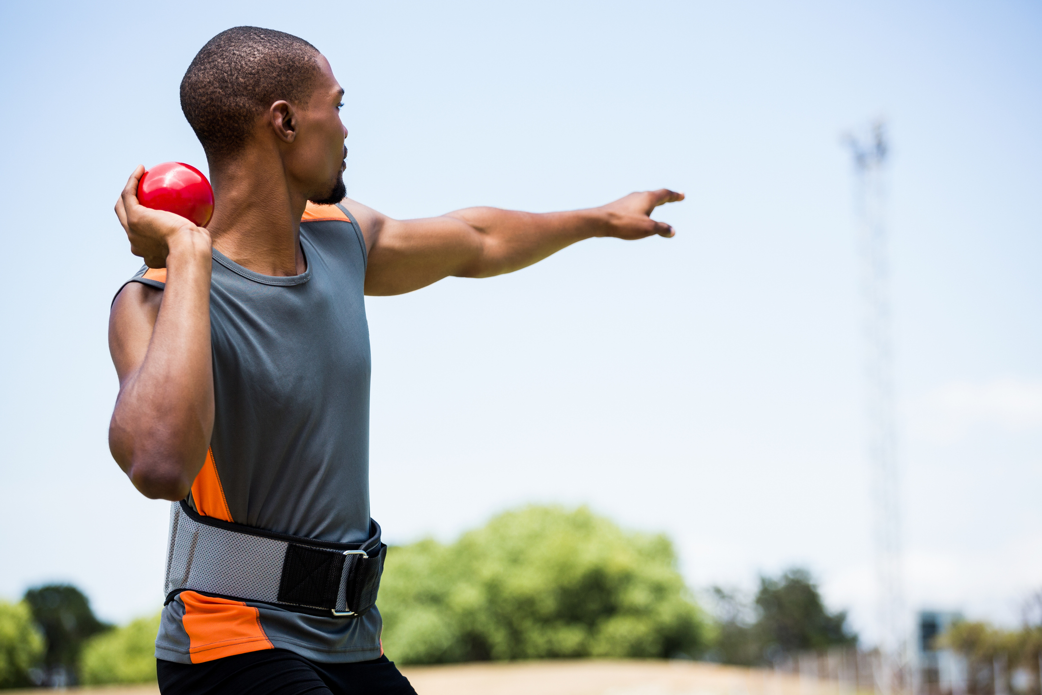 A man throwing a shot put 