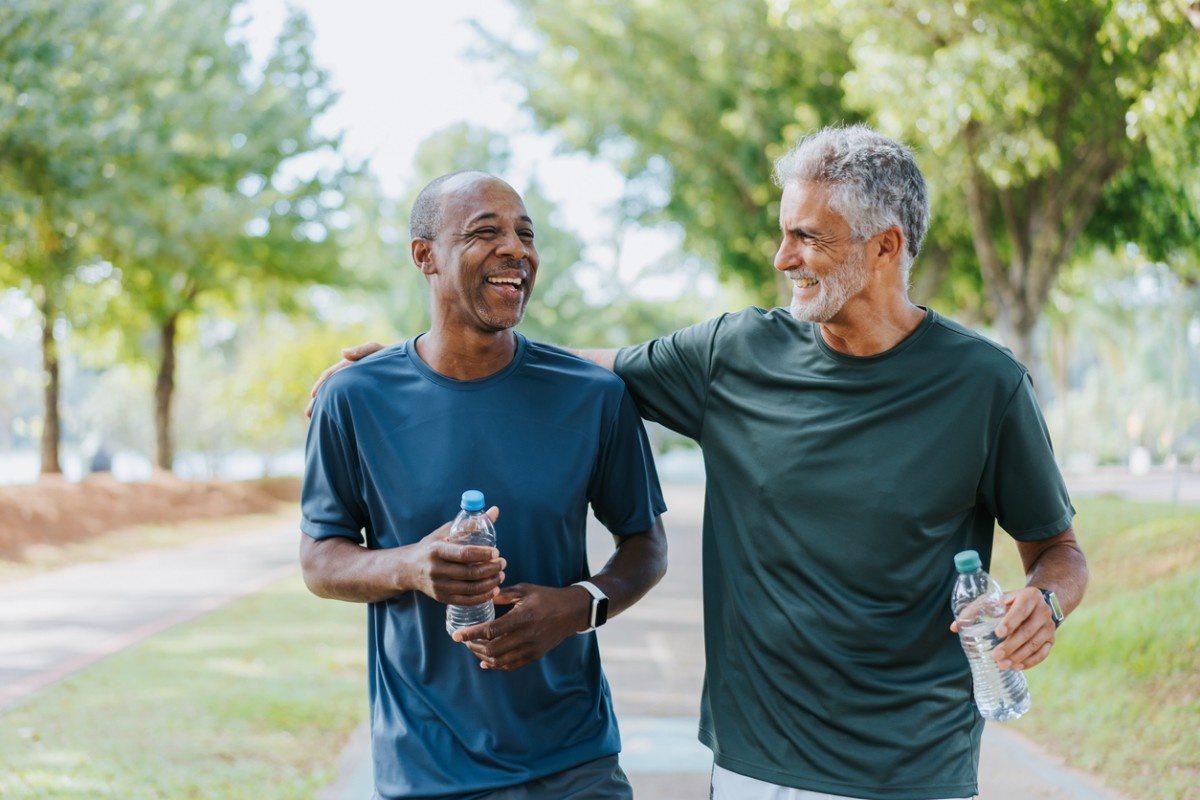 Two gentlemen after parkrun with their water bottles