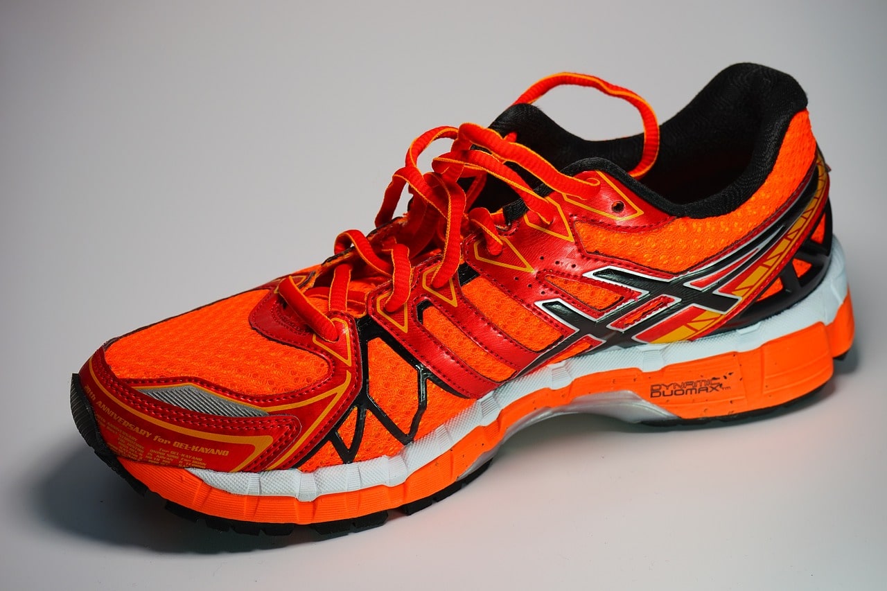 An image of an orange Asics running shoe