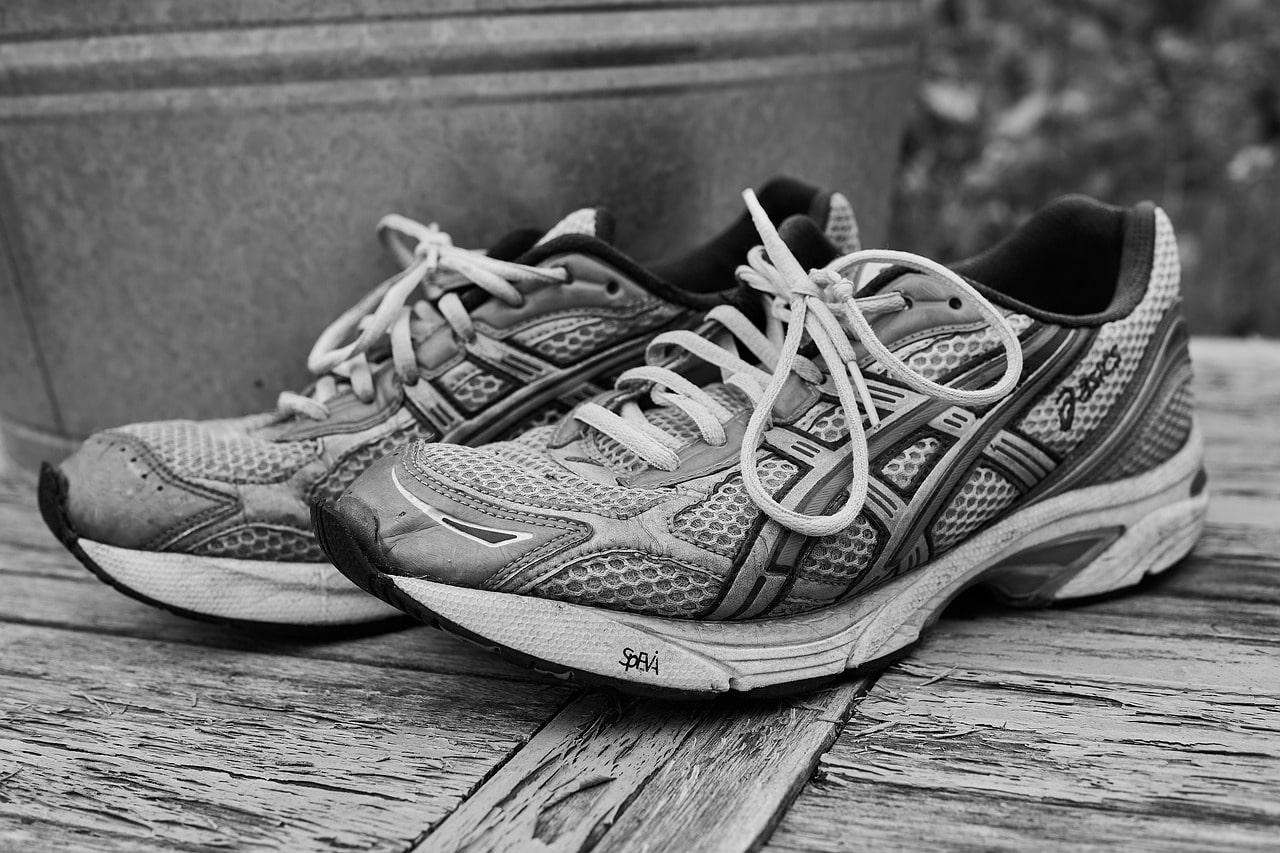 A black and white image of Asics running shoes 