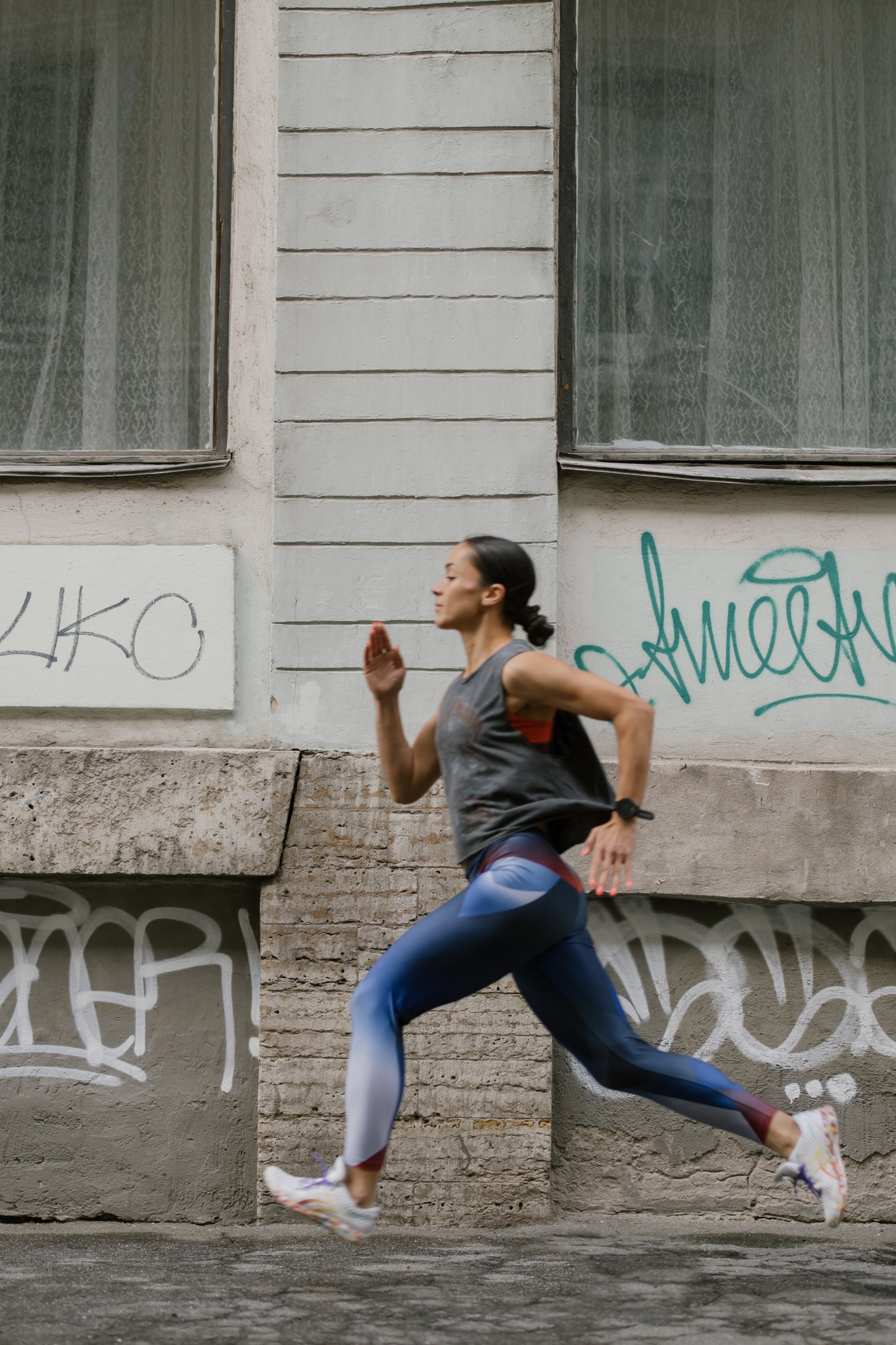 An image of a woman running in an urban area 