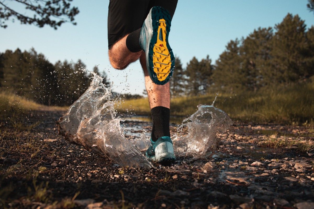 A person trail running in waterproof shoes