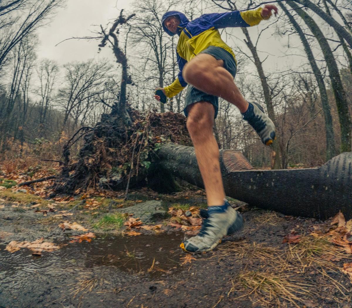 A person trail running in the rain 