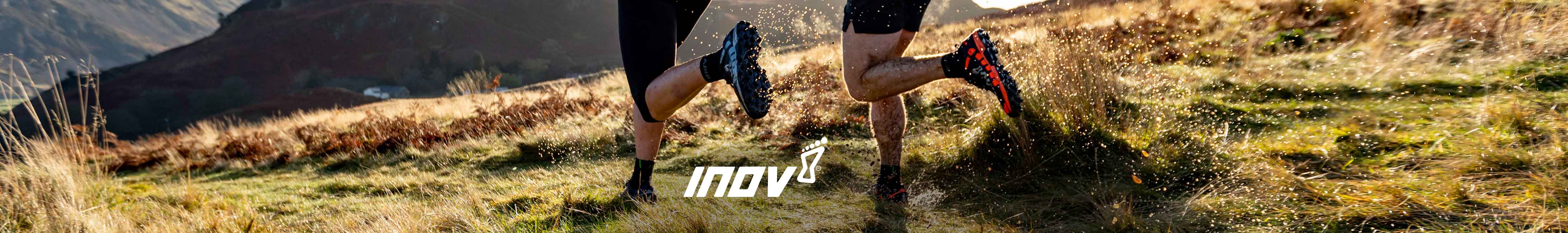 Inov header. Two people trail running in their Inov-8 trail shoes 