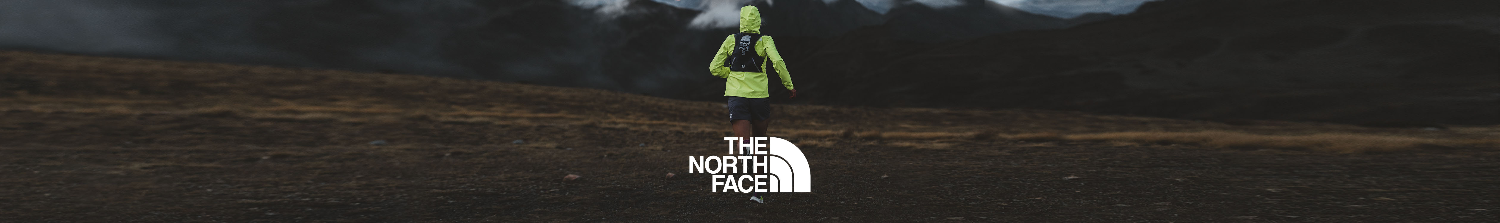 The North Face brand page. A pearson running across the field wearing The North Face gear