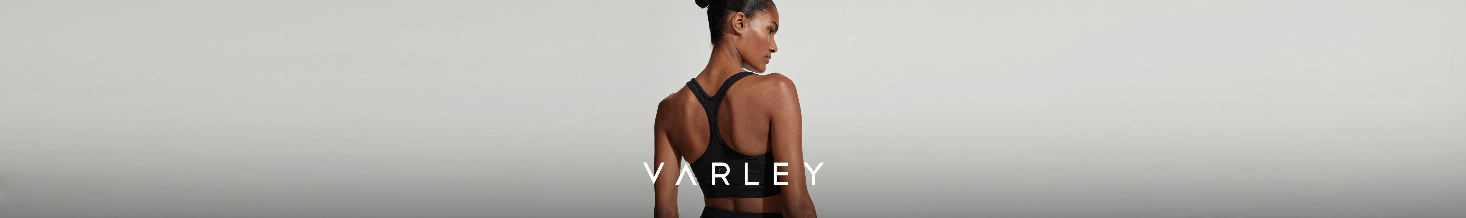 Varley brand page. Lady wearing sports bra from Varley collection