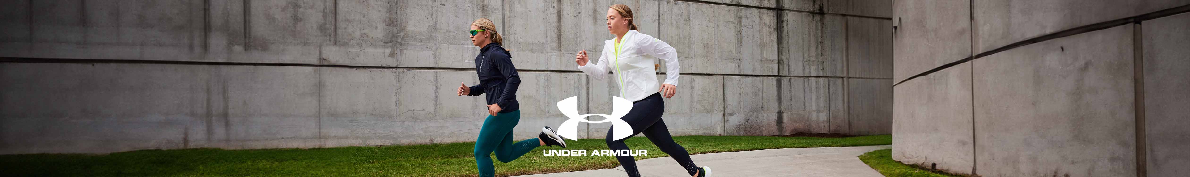 Shop Under Armour. A group of runners on the street