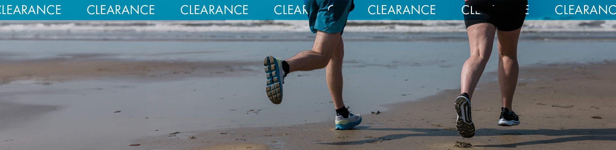 Shop Shoes clearance. Two runners on the beach