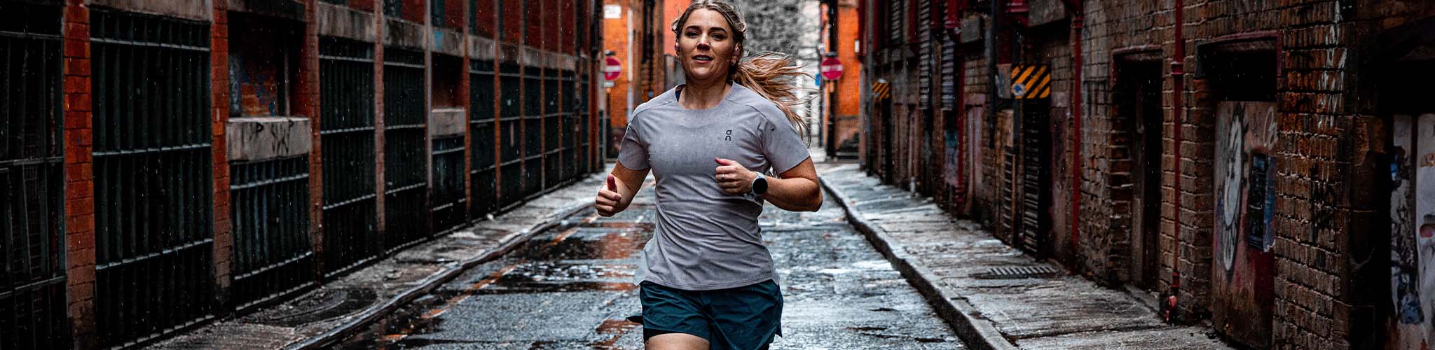 Shop Clothing new season. A woman running on the street