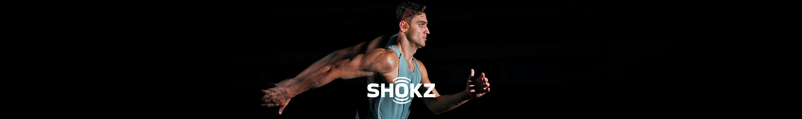 Shop shokz headphones. A runner wearing Shokz headpones while running