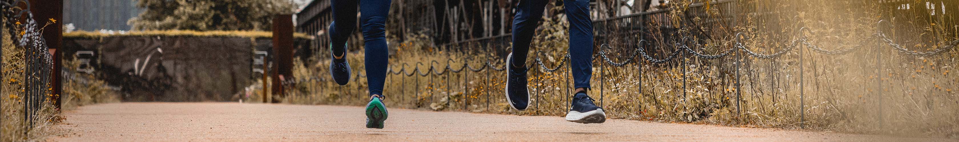 Shop Women's shoes new arrivals. Man and woman running on a street