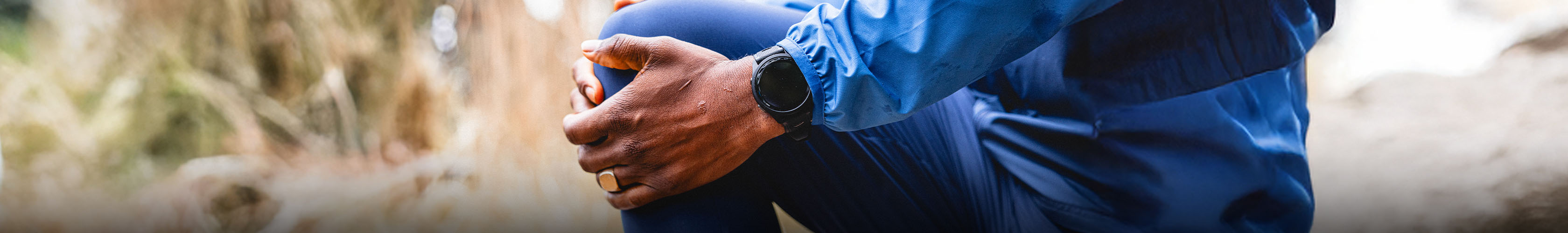 Shop sport watches. A person doing streches before running while wearing watch on their wrist